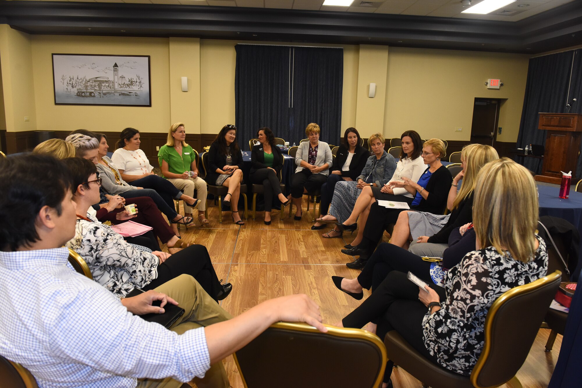 Key Spouse Program members participate in a circle discussion to share and discuss ideas to better communicate with spouses at their respective squadrons during a conference at Fairchild Air Force Base, Washington, Aug. 30, 2018. Key spouses are appointed and trained to serve   as a conduit for spouses on behalf of the unit commander. (U.S. Air Force photo/Airman 1st Class Lawrence Sena)