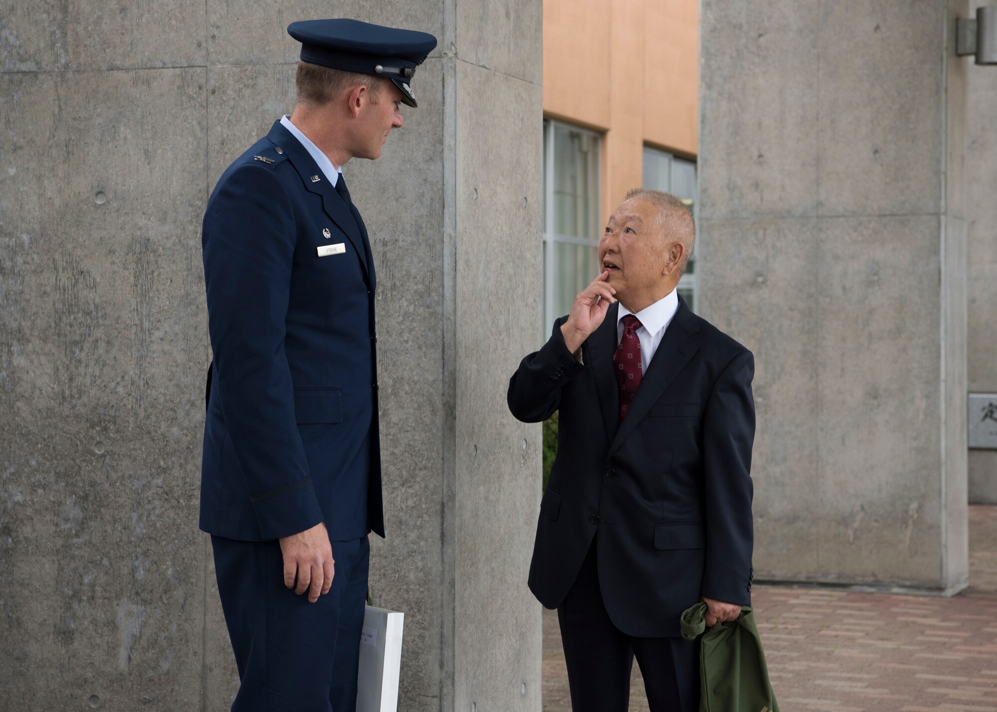 U.S. Air Force Col. Kristopher W. Struve, left, the 35th Fighter Wing commander, speaks with Tetsuro Asano, right, a Misawa City resident, after the Misawa City 60th anniversary celebration ceremony held at the Misawa International Center in Misawa City, Japan, Sept. 1, 2018. Misawa Air Base commanders received recognition during the ceremony for representing a vital part of the region’s ongoing progress.  (U.S. Air Force photo by Airman 1st Class Collette Brooks)