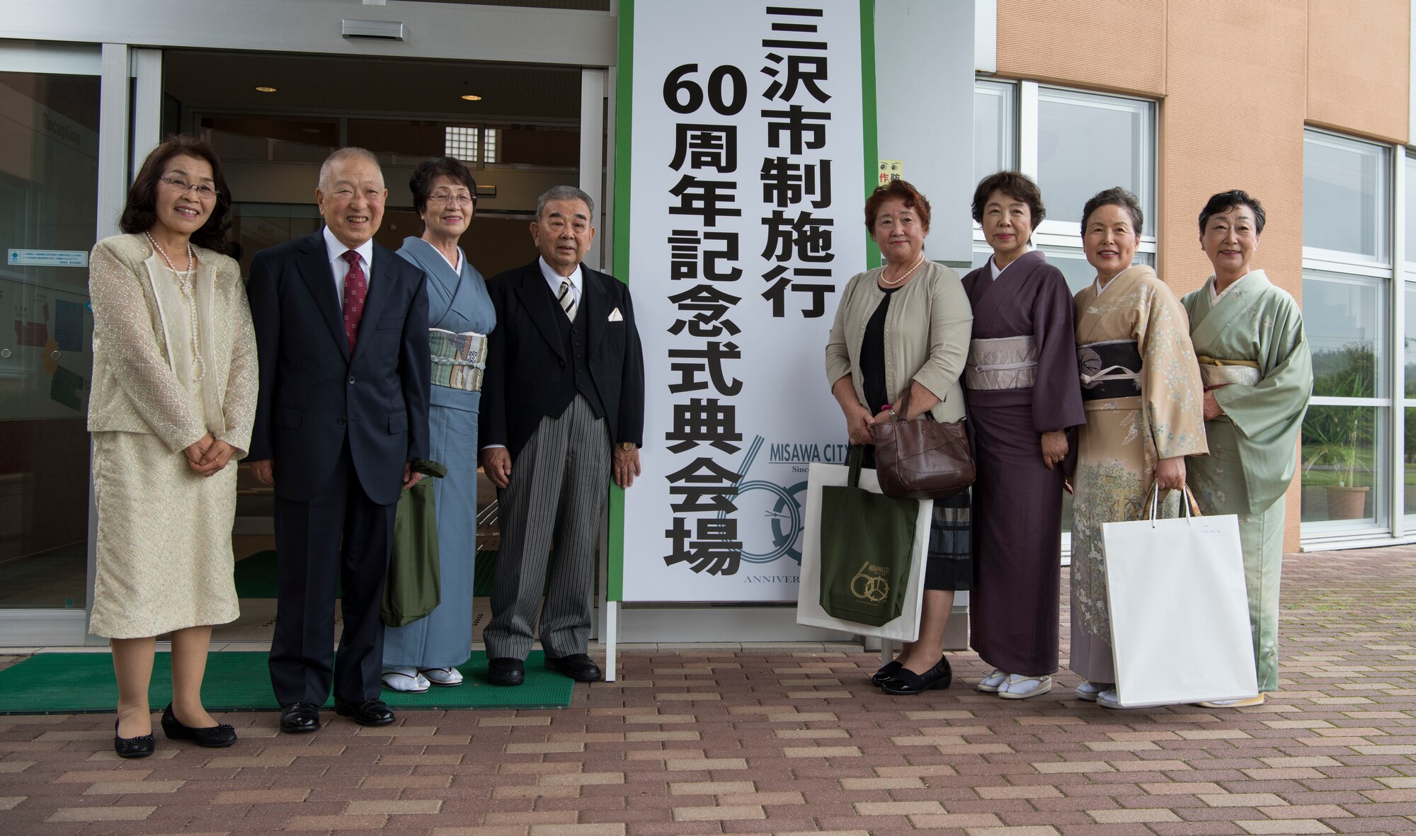 A group of Misawa city residents pose for a photo at the Misawa City 60th anniversary celebration ceremony held at the Misawa International Center in Misawa City, Japan, Sept. 1, 2018. Kazumasa Taneichi, the Misawa City mayor, noted he is impressed with Misawa City residents’ resiliency when faced with challenges such as natural disasters. (U.S. Air Force photo by Airman 1st Class Collette Brooks)