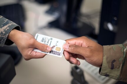 The 6th Force Support Squadron military personnel flight assists customers with common access cards, dependent IDs, reserve IDs, retiree IDs, and Defense Enrollment Eligibility Reporting System (DEERS) updates at the DEERS & ID Cards office on base on MacDill Air Force Base, Fla., Aug. 23, 2018.