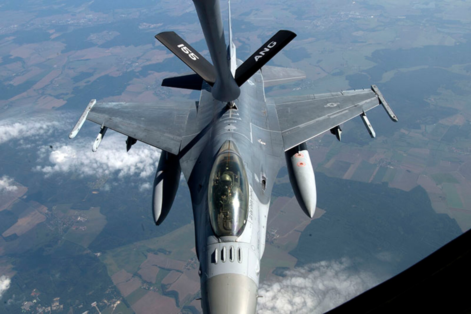 An F-16 Fighting Falcon aircraft from the 162nd Wing, Arizona Air National Guard, gets refueled by a KC-135 Stratotanker refueling aircraft from the 155th Air Refueling Wing, Nebraska Air National Guard, during Exercise Ample Strike 2018 at over Pardubice Air Base, Czech Republic. AMSE 18 is a Czech Republic led, multinational live exercise that offers advanced air/land integration training to Joint Terminal Attack Controllers (JTACs) and Close Air Support (CAS) aircrews. (U.S. Air National Guard Photo by Tech. Sgt. Rana Franklin)