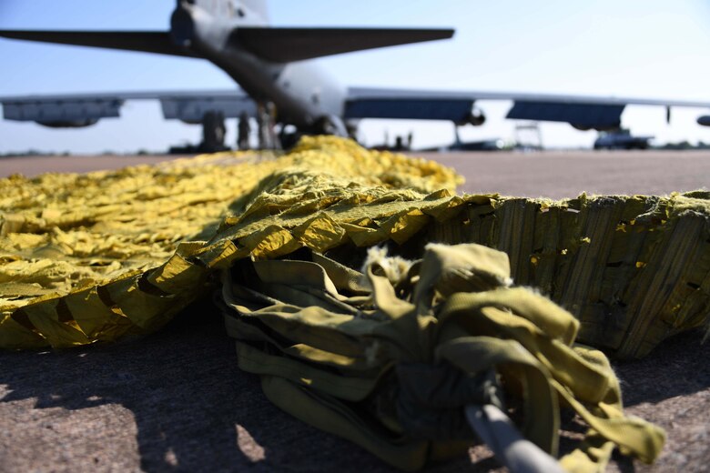 The drage chute of a B-52 Stratofortress from Barksdale Air Force Base awaits collection at RAF Fairford, United Kingdom, Sept. 5, 2018.   The jet is in the U.K. in support of AMPLE STRIKE 18, a Czech-led exercise involving 19 NATO allies and partners.  The exercise is designed to test interoperability with Joint Terminal Air Controllers from multiple countries. Citizen Reserve Airmen and their active-duty counterparts from multiple units are working together at RAF Fairford to support bomber operations during the exercise.   (U.S. Air Force photo by Master Sgt. Ted Daigle/not released)