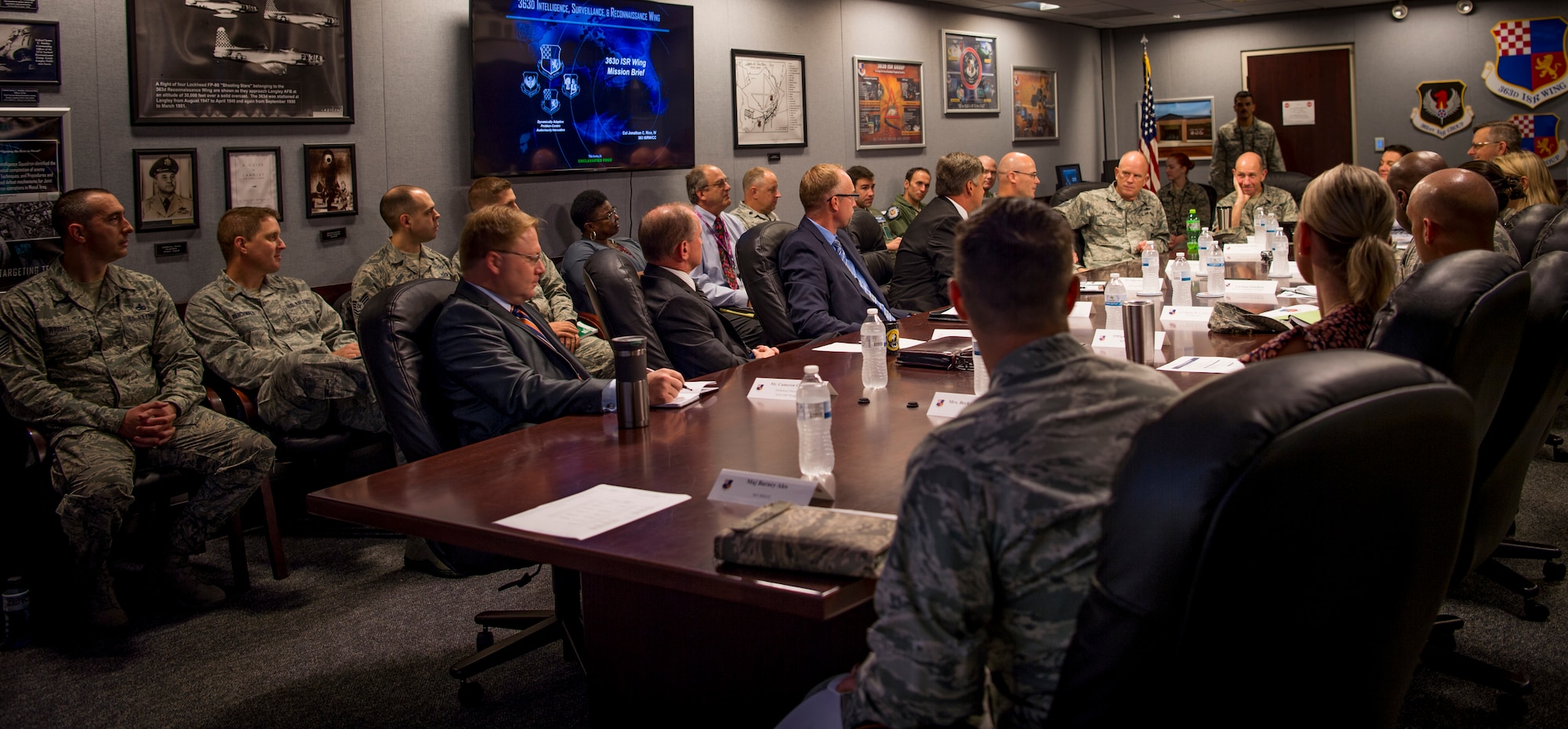 U.S. Air Force Gen. Mike Holmes, commander of Air Combat Command, and his wife Sara Holmes visit the 363rd Intelligence Surveillance Reconnaissance Wing at Joint Base Langley-Eustis, Virginia, Sept. 5, 2018. Holmes met with senior leaders and attended several briefings to learn more about the 363rd ISRW’s mission, Airmen and innovation initiatives. (U.S. Air Force photo by Staff Sgt. Areca T. Bell)