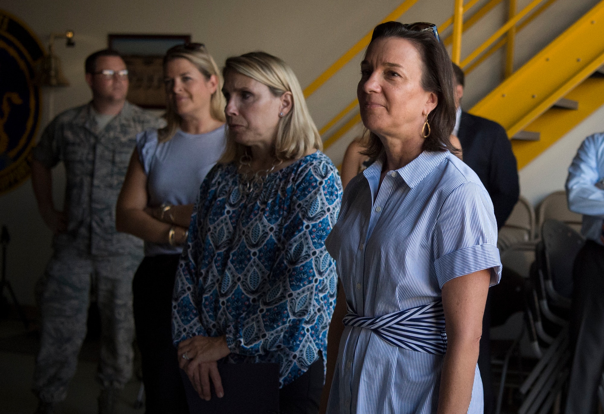 Right, Sara Holmes, wife of U.S. Air Force Gen. Mike Holmes, commander of Air Combat Command, attends a mission brief during a visit to the 363rd Intelligence Surveillance Reconnaissance Wing at Joint Base Langley-Eustis, Virginia, Sept. 5, 2018. Holmes visited various units within the 363rd ISRW to learn about its mission and Airmen. (U.S. Air Force photo by Staff Sgt. Areca T. Bell)