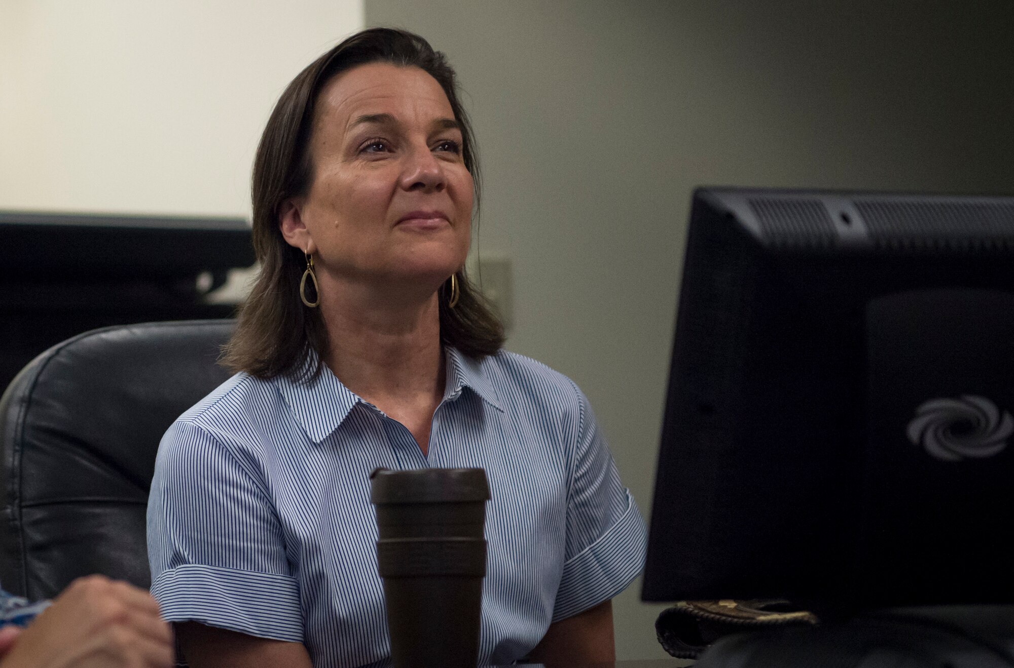Sara Holmes, wife of U.S. Air Force Gen. Mike Holmes, commander of Air Combat Command, attends a mission brief during a visit to the 363rd Intelligence Surveillance Reconnaissance Wing at Joint Base Langley-Eustis, Virginia, Sept. 5, 2018. During the visit, Holmes also met with spouses to discuss the key spouse program and efforts to improve Airman and family resiliency within the 363rd ISRW. (U.S. Air Force photo by Staff Sgt. Areca T. Bell)