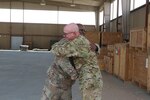 Army Staff Sgt Robert Morneau, right, a crew chief assigned to 1st Battalion, 126th Aviation Regiment (General Support Aviation Battalion), embraces Army Sgt 1st Class Giovanni Ford, the 449th Combat Aviation Brigade Headquarters and Headquarters Companyâ€™s supply sergeant at Camp Buehring, Kuwait, Aug. 21, 2018. The two noncommissioned officers are childhood comrades that havenâ€™t seen each other for 30 years until they ran into each other on their 2017-2018 deployment in support of Operations Inherent Resolve and Spartan Shield. Army photo by Capt. Briana McFarland