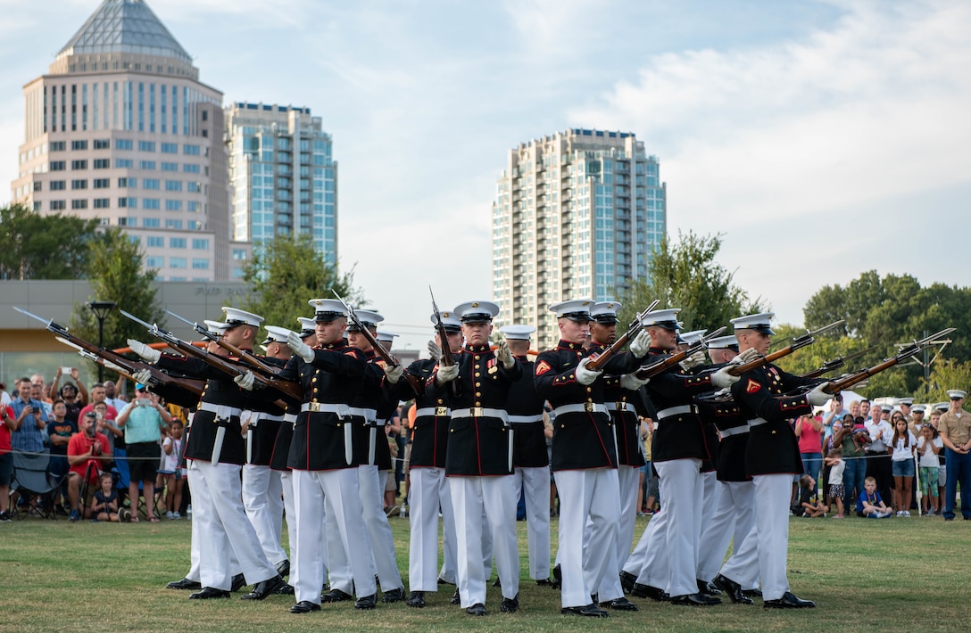 The Silent Drill platoon performs at Marine Week Charlotte in downtown Charlotte, N.C., Sept. 5, 2018. Marine Week is an annual event that allows members of the Marine Corps to demonstrate their capabilities and allows the public to interact with service members. Marine Week Charlotte is an opportunity for Marines to reconnect with our Marines, sailors, veterans, and their families from different generations.