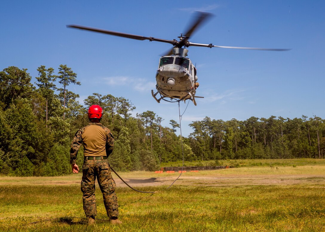 U.S. Marines conduct a special patrol insertion and extraction rigging exercise on Stone Bay, N.C., Aug. 29, 2018. Marine Light Attack Helicopter Squadron 167 supported the helicopter rope suspension technic masters course which certifies Marines in the ability to land and take off quickly in situations where the aircraft may have difficulty landing. HMLA-167 is a part of Marine Aircraft Group 29, 2nd Marine Aircraft Wing.