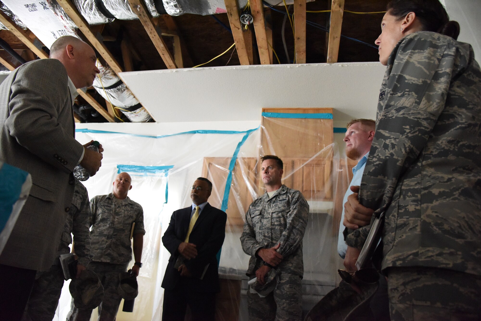 John Hoyt, Hunt military communities vice president, explains the remediation work being accomplished by Hunt inside base housing to Keesler leadership at Bay Ridge Housing on Keesler Air Force Base, Mississippi, Aug. 28, 2018. Base leadership took time to better understand the process of mold remediation in base housing in order to better serve the Airmen who live there. (U.S. Air Force photo by Kemberly Groue)