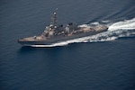 The guided missile destroyer USS The Sullivans conducts a routine transit through the Strait of Hormuz.