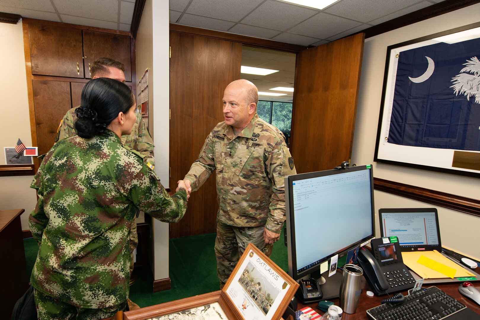 Republic of Colombia army judge advocates meet with U.S. Army Maj. Gen. Robert E. Livingston, Jr., the adjutant general for the South Carolina National Guard. The JAGs are visiting South Carolina to collaborate on ideas during the transformation of the Colombian military justice systems, Columbia, S.C., Aug. 29, 2018.