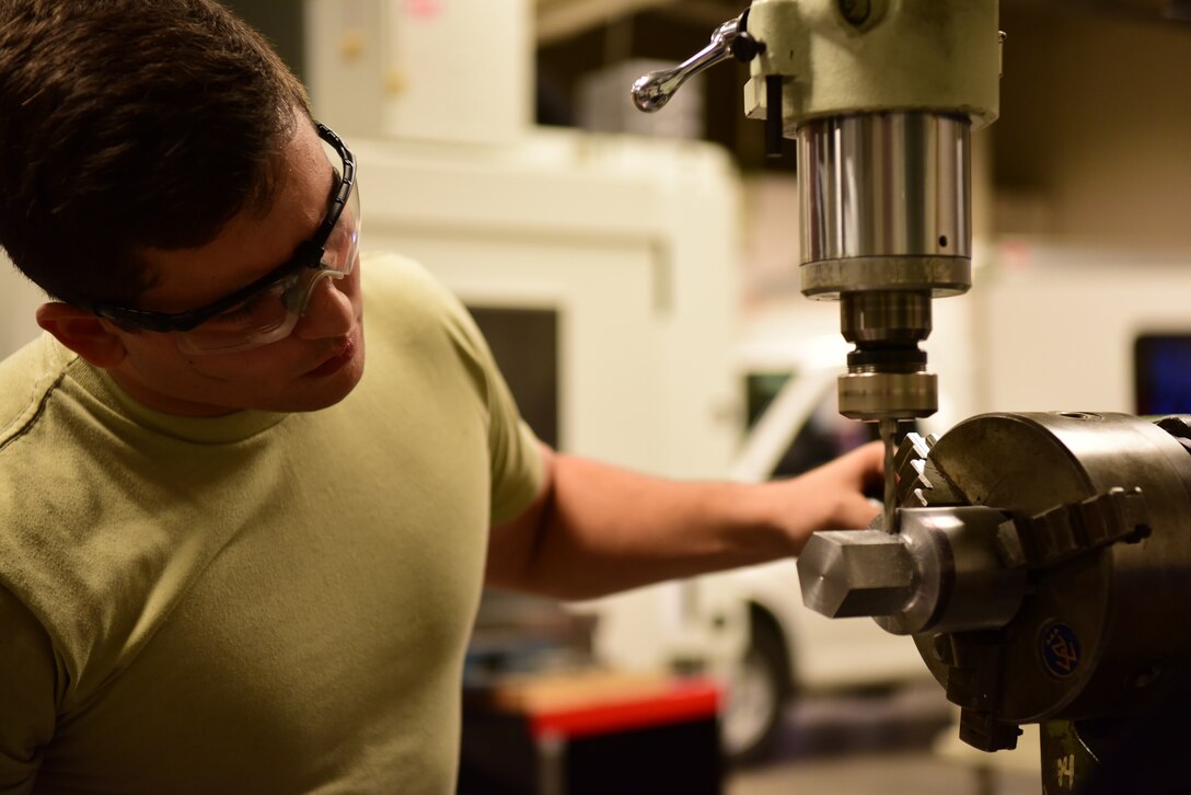 Airman 1st Class Christian Martinez, a 28th Maintenance Squadron metals technician, uses a drill press at Ellsworth Air Force Base, S.D., Aug. 23, 2018. The metals technology shop runs 24-hour operations to provide different metals technologies for all squadrons on base. (U.S. Air Force photo by Airman John Ennis)
