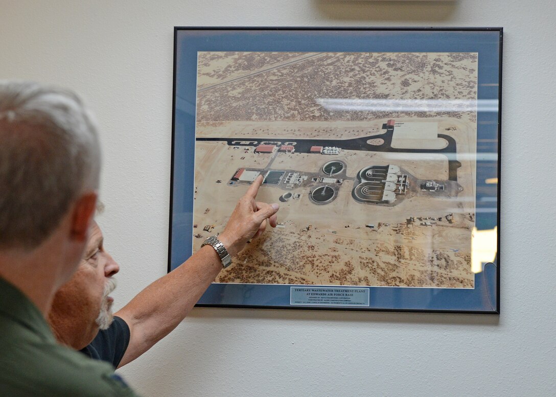 Thomas Allen, 412th Civil Engineer Squadron, shows how the Edwards Wastewater Treatment Plant is laid out to a tour group Sept. 4. The treatment plant was built in 1996. (U.S. Air Force photo by Kenji Thuloweit)