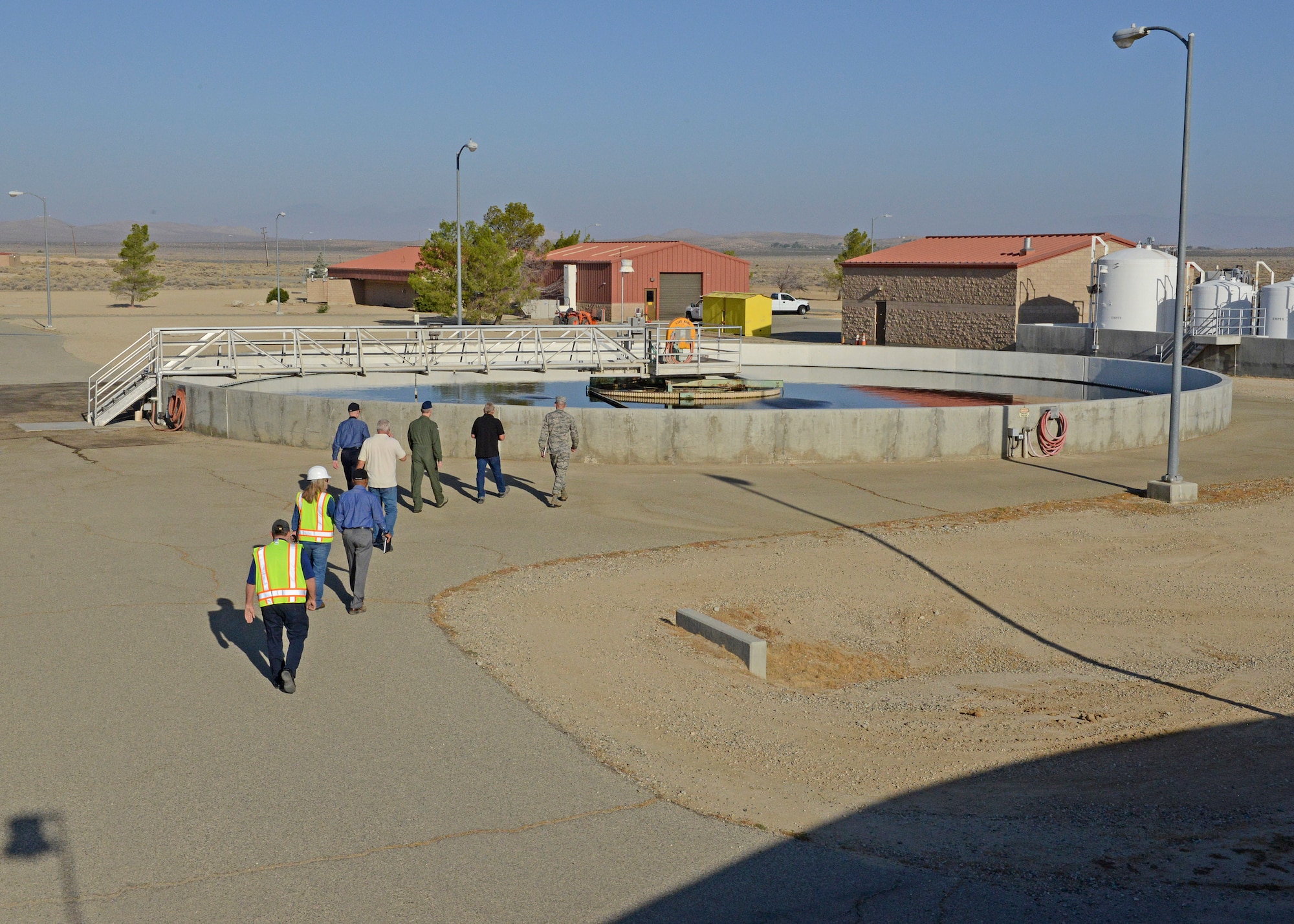 Brig. Gen. E. John Teichert, 412th Test Wing commander, and Col. Kirk Reagan, 412th TW vice commander, tour the Edwards Wastewater Treatment Plant located at the southern part of the base Sept. 4. (U.S. Air Force photo by Kenji Thuloweit)
