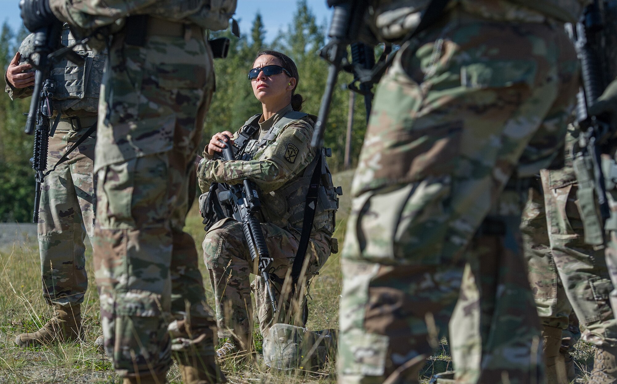 Army Staff Sgt. Daniell Garcia, assigned to the Joint Base Lewis-McChord based 13th Combat Support Sustainment Battalion, a native of Rocky Ford, Colo., listens to a safety briefing before beginning the first day of the America’s First Corps 2-Gun Sharpshooter Competition sponsored by U.S. Army Alaska's Sharpshooter Team at the Joint Base Elmendorf-Richardson, Alaska, Range Complex, Sept. 5, 2018.  Ten five-soldier teams assigned to multiple units throughout I Corps will compete in six stages of competition over two days with U.S. Army issued weapons for top sharpshooter honors.