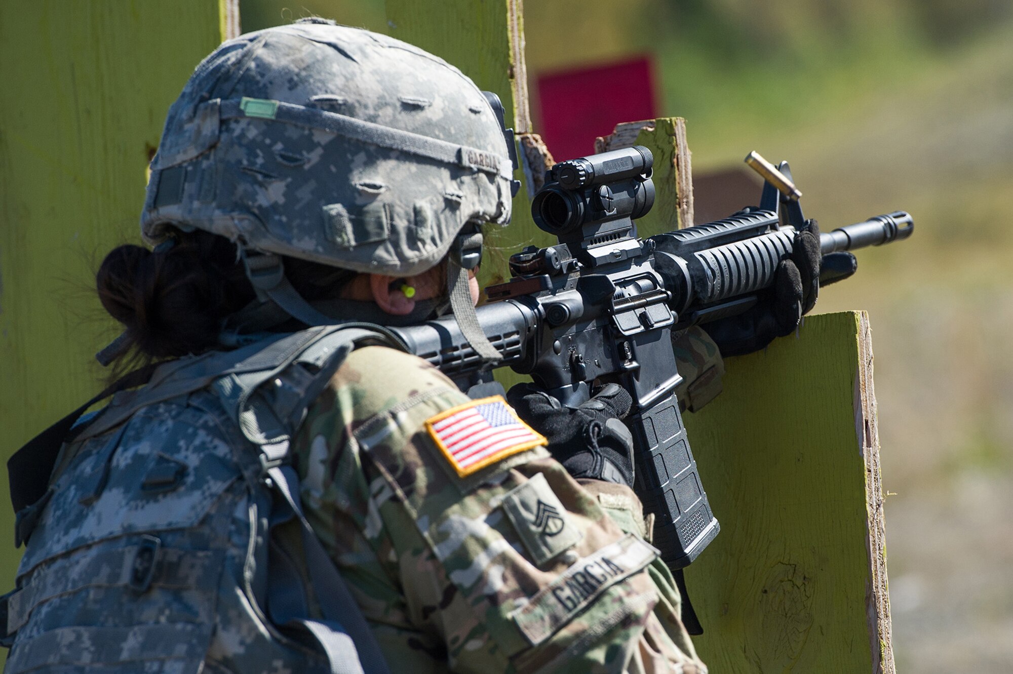 Army Staff Sgt. Daniell Garcia, assigned to the Joint Base Lewis-McChord based 13th Combat Support Sustainment Battalion, a native of Rocky Ford, Colo., competes in the first day of the America’s First Corps 2-Gun Sharpshooter Competition sponsored by U.S. Army Alaska's Sharpshooter Team at the Joint Base Elmendorf-Richardson, Alaska, Range Complex, Sept. 5, 2018.  Ten five-soldier teams assigned to multiple units throughout I Corps will compete in six stages of competition over two days with U.S. Army issued weapons for top sharpshooter honors.