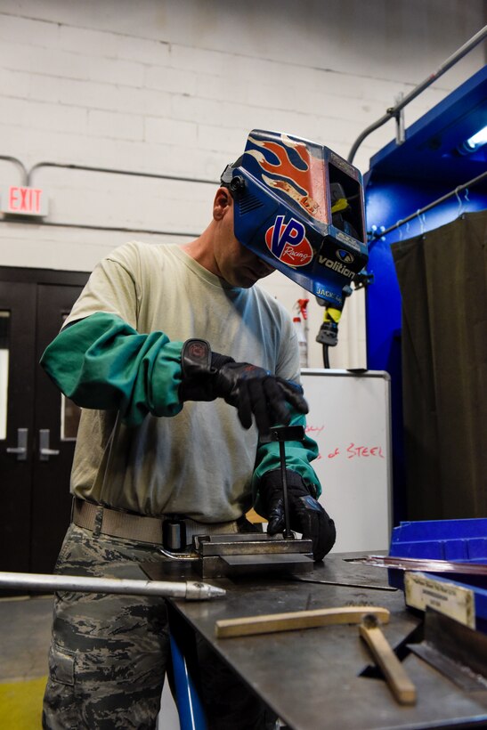 Metals Tech. instructor demonstrates welding to students.