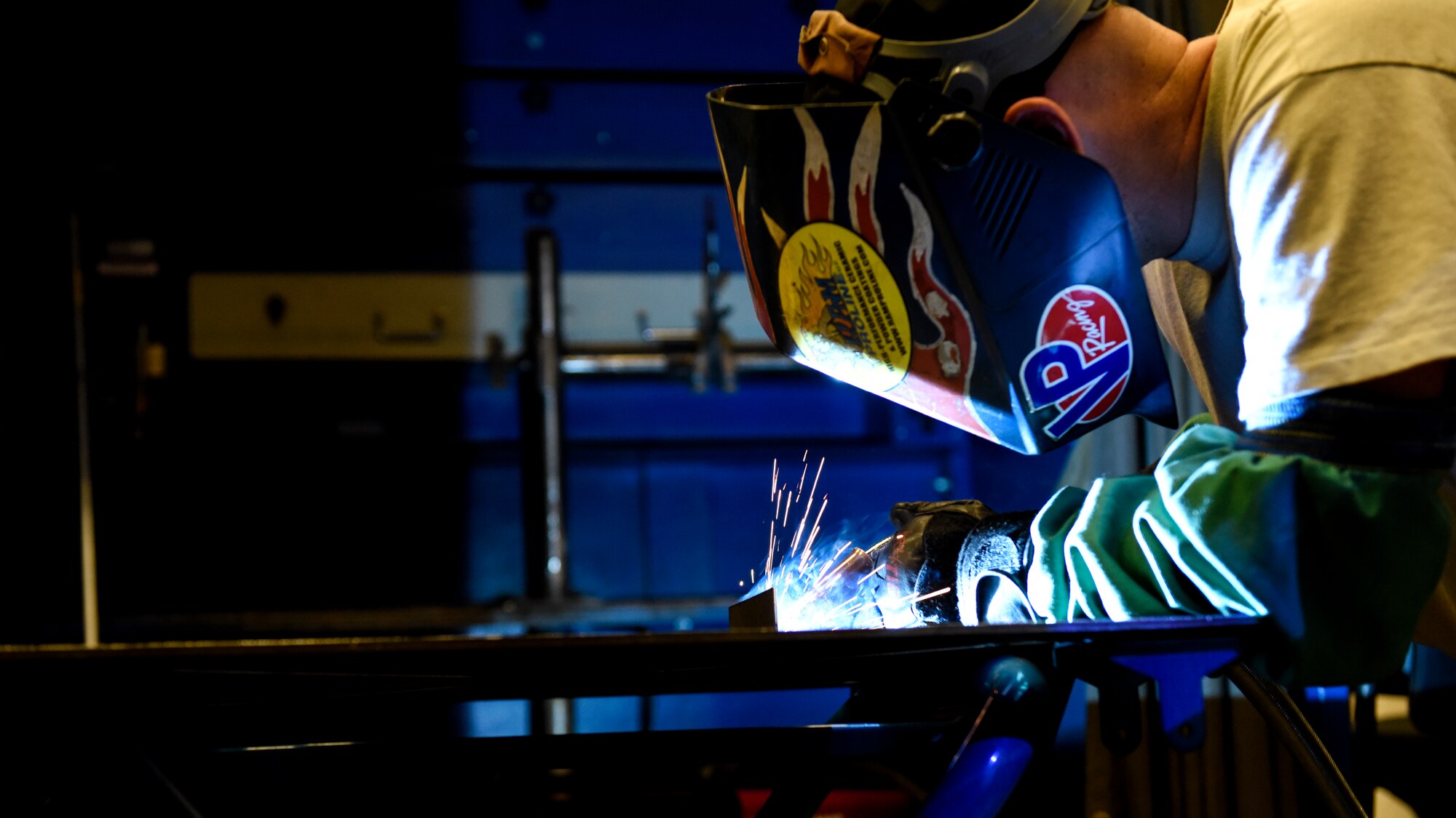 Metals Tech. instructor demonstrates welding to students.