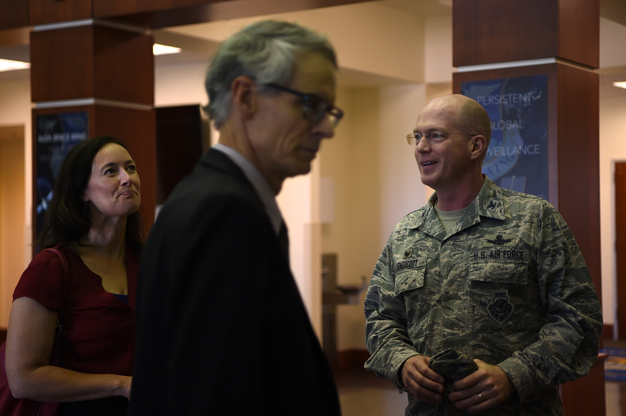 Col. Troy Endicott, 460th Space Wing commander, gives a brief history of the 460th headquarters building to Aurora city officials, Sept. 5, 2018, on Buckley Air Force Base, Colorado. The mission of the 460th SW is to deliver global infrared surveillance, tracking and missile warning for theater and homeland defense and provide combatant commanders with expeditionary warrior Airmen. (U.S. Air Force photo by Airman 1st Class Codie Collins)