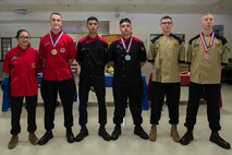 The Marines competing in the Food Specialist of the Quarter pose for a group photo at Camp Kinser, Okinawa, Japan, Aug. 30, 2018. First place winners, left, Pfc. Dominic Marimonti and Cpl. Lexus Martinez, both food service specialist with 3rd Marine Logistic Group Headquarters Regiment; second place winners, center, Lance Cpl. Zachery Lacroix, and Lance Cpl. Jairo Salgado, both food service specialist with Headquarters Battalion, 3rd Marine Division; third place winners, right, Lance Cpl. Nathaniel Lagoydespaw and Lance Cpl. Jeremy Reynolds, both food service specialist with 3rd Battalion, 12th Marine Regiment. (U.S. Marine Corps photo by Pfc. Kindo Go)