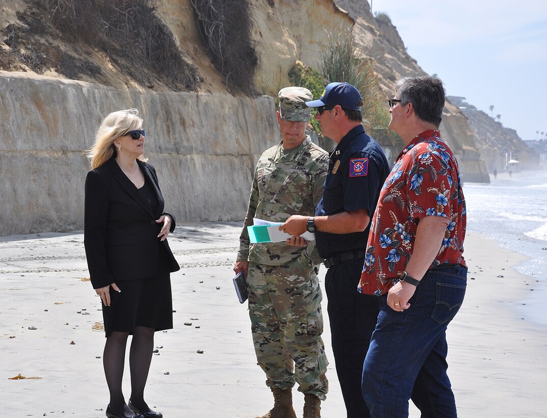 Col. Aaron Barta, U.S. Army Corps of Engineers Los Angeles District commander, second from left, meets with representatives from the City of Encinitas to discuss the Corps’ Encinitas and Solana Beach Coastal Storm Damage Reduction project during an Aug. 29 site visit at Moonlight Beach in Encinitas, California.