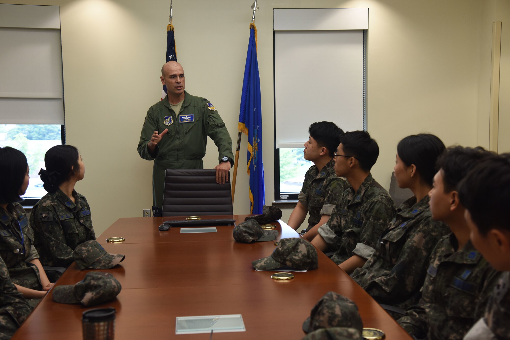 U.S. Air Force Col. Victor Ortiz, center, 51st Medical Group deputy commander, greets Republic of Korea Air Force flight technicians and flight nurses before a flight nurse briefing at the 51st Medical Group hospital at Osan Air Base, Republic of Korea, Sept. 6, 2018. The personnel, who are students of the Republic of Korea Aeromedical Center Primary Flight Nurse Course in Cheongju, participated in patient loading and unloading procedures and walked through the decontamination room. (U.S. Air force photo by Tech Sgt. Ashley Tyler)