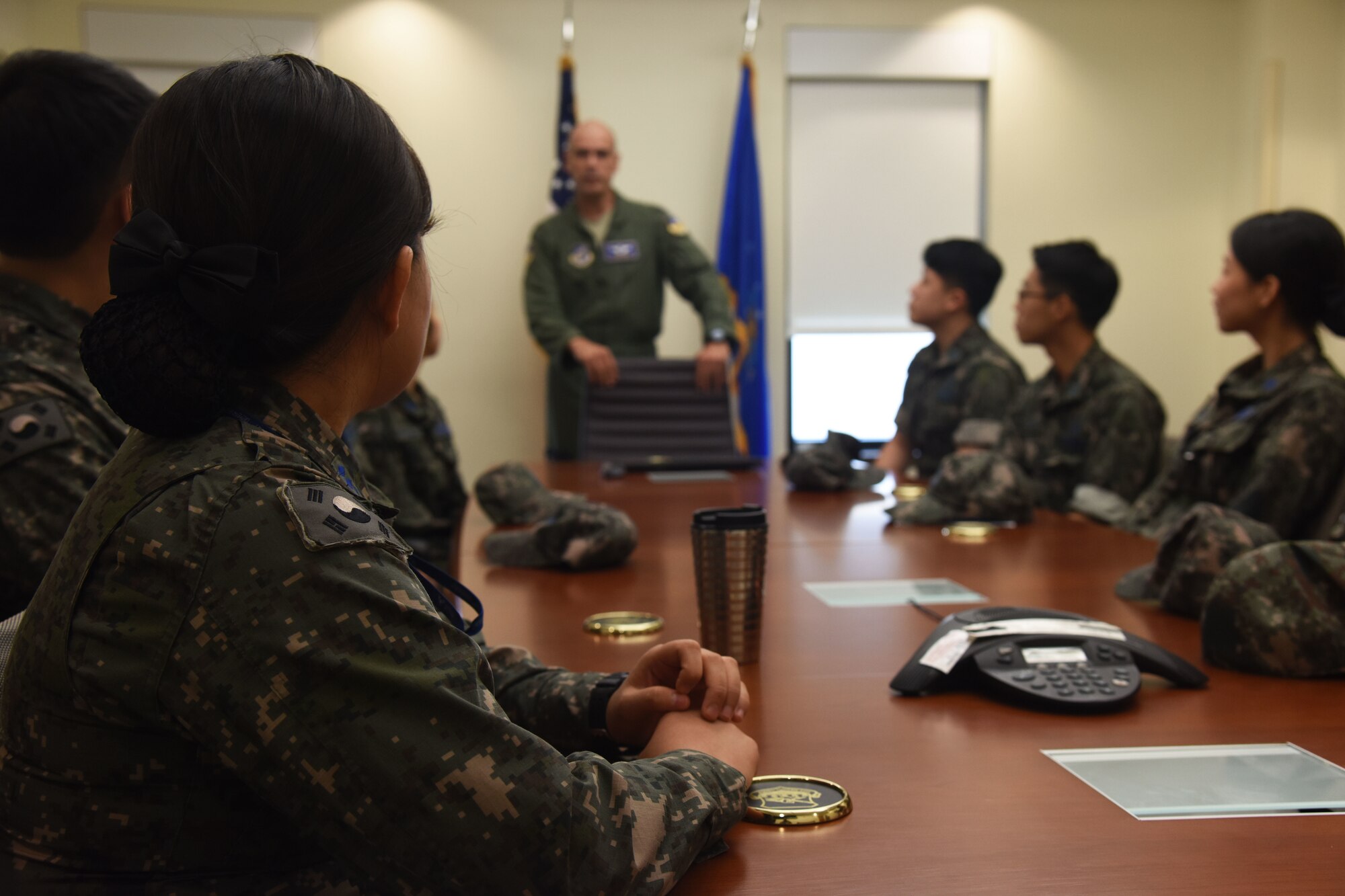 U.S. Air Force Col. Victor Ortiz, 51st Medical Group deputy commander, greets Republic of Korea Air Force flight technicians and flight nurses before a flight nurse briefing at the 51st Medical Group hospital at Osan Air Base, Republic of Korea, Sept. 6, 2018. The personnel, who are students of the Republic of Korea Aeromedical Center Primary Flight Nurse Course in Cheongju, participated in patient loading and unloading procedures and walked through the decontamination room. (U.S. Air force photo by Tech Sgt. Ashley Tyler)