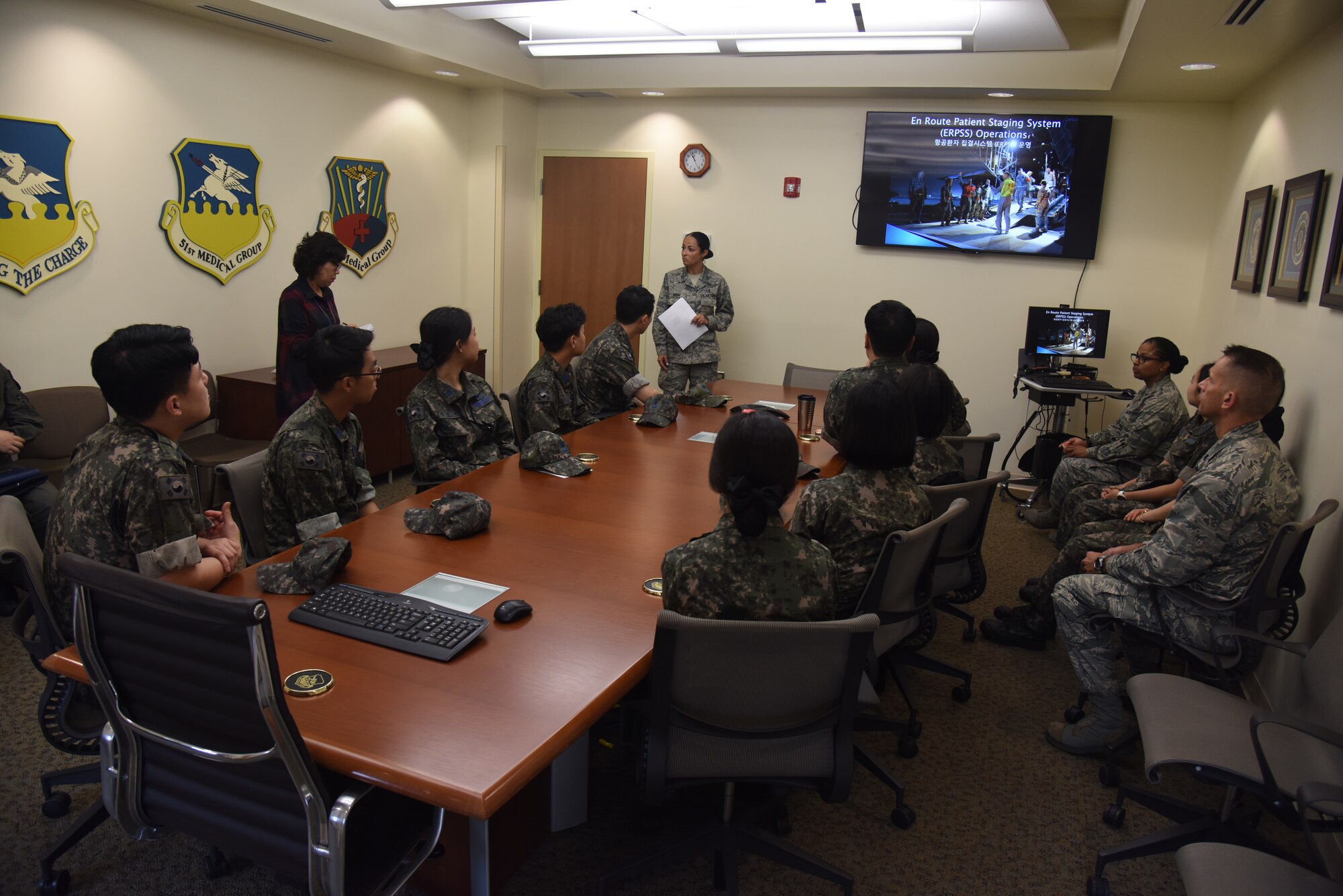 U.S. Air Force Capt. Johanna Boone, 701st Combat Operations Squadron medical readiness officer, briefs Republic of Korea Air Force flight technicians and flight nurses during a tour of the 51st Medical Group hospital at Osan Air Base, Republic of Korea, Sept. 6, 2018. Boone, a reservist from March Air Reserve Base, explained U.S. Air Force procedures to the Republic of Korea Aeromedical Center Primary Flight Nurse Course students, who visit the 51st MDG every few years as part of their course. (U.S. Air force photo by Tech Sgt. Ashley Tyler)