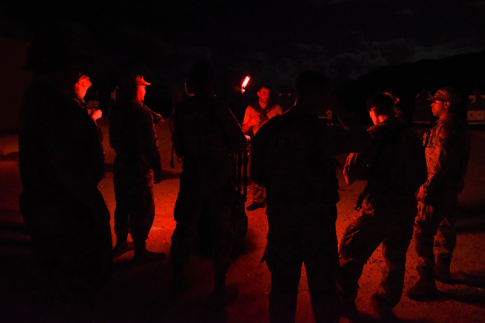 Staff Sgt. Robert Blackburn, 36th Security Forces Squadron noncommissioned officer in charge of the Jungle Enforcement Team, explains the process of the Jungle Patrol qualifying test Aug. 26, 2018, at Andersen Air Force Base, Guam. The test lasted roughly 14 hours and included a number of disciplines such as jungle navigation and managaging cognitive and psychiological resilinecy under stress. (U.S. Air Force photo by Tech. Sgt. Jake M. Barreiro)
