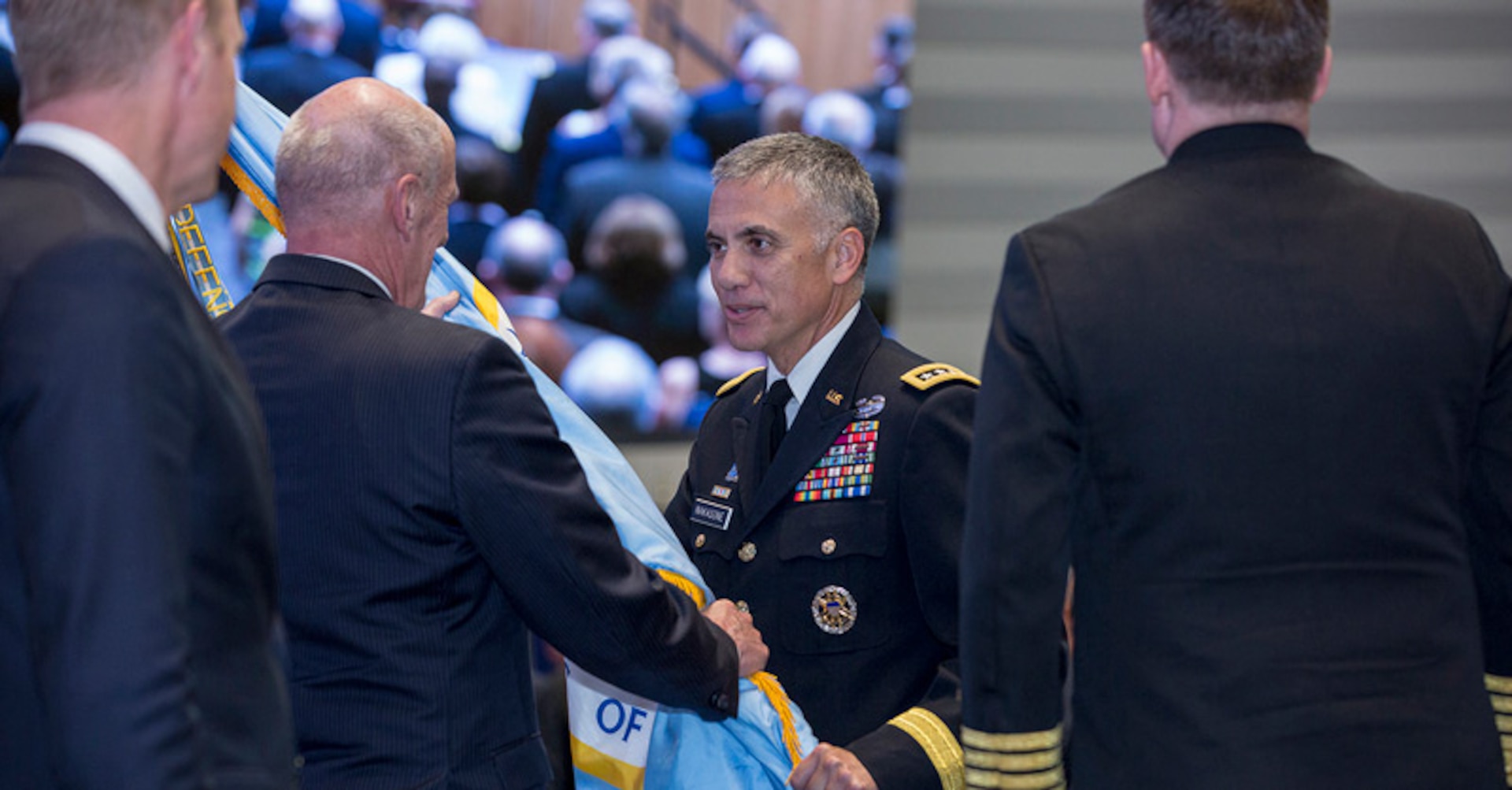 General Nakasone accepts the NSA/CSS flag at his swearing in ceremony.