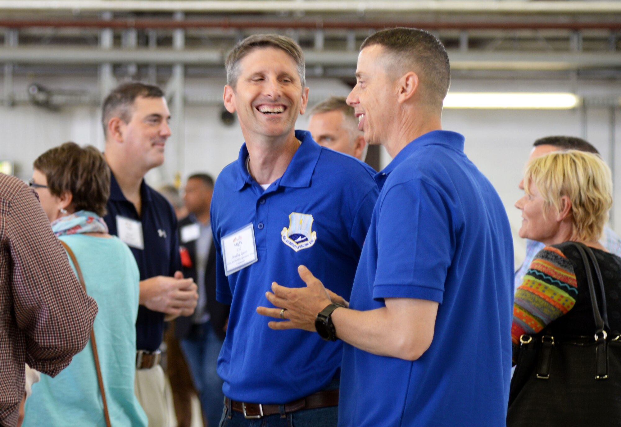 U.S. Air Force Col. Bradley L. Spears, 521st Air Mobility Operations Wing vice commander chats with guests during the Host Nation Civic Leader dinner social on Ramstein Air Base, Germany, Aug. 31, 2018. Guests exchanged experiences of the day's events at the dinner social.