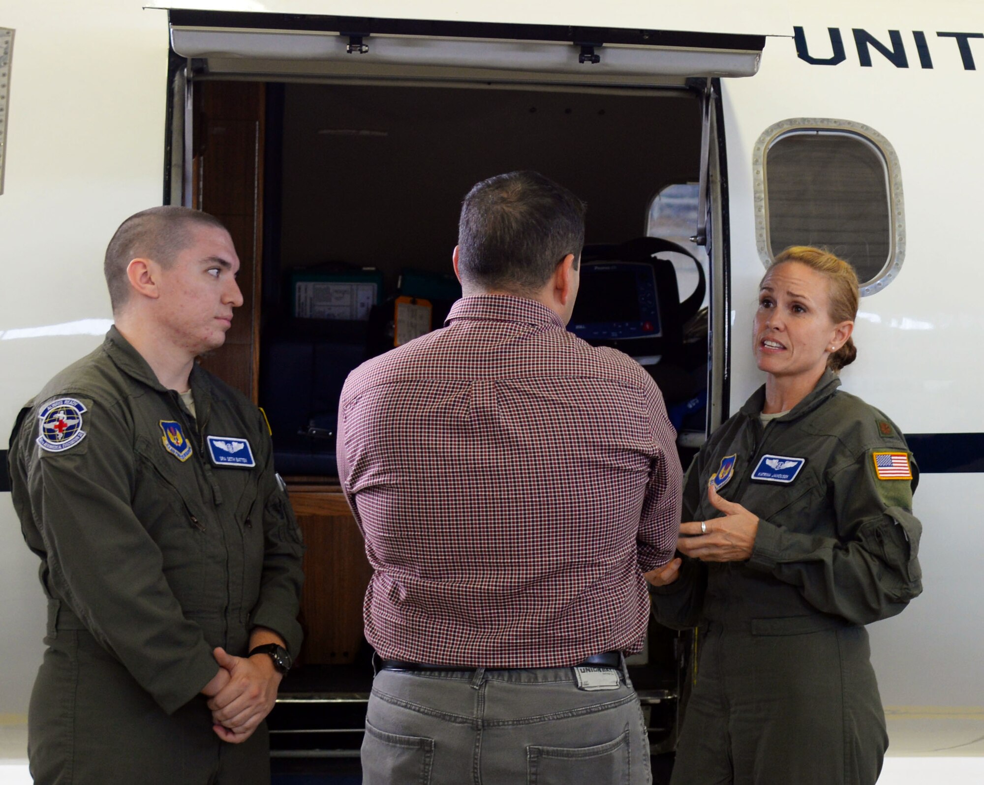 U.S. Air Force maj. Katrin Janousek, 86th Aeromedical Evacuation Squadron Flight Nurse, gives a tour of a C-21A aircraft during a Host Naiton Civic Leader dinner on Ramstein Air Base, Germany, Aug. 31, 2018. The C-21A is used for aeromedicall evacatutions for Airmen to provide ground support, advanced life support, and ciritical care.