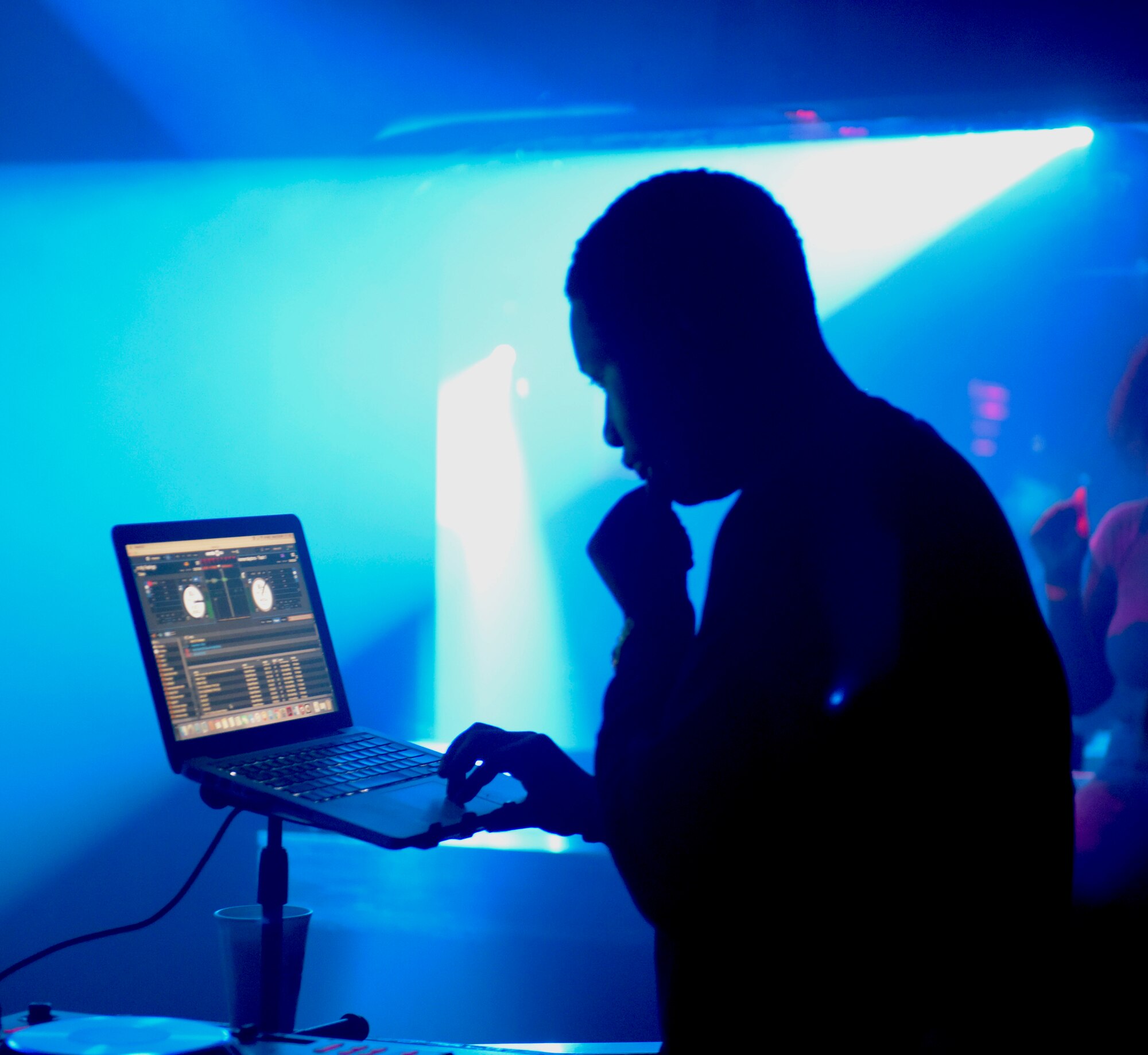 U.S. Air Force Staff Sgt. Elijah Rasheed, 100th Logistics Readiness Squadron aircraft parts store supervisor, mixes music for his disc jockey set at a local club in Cambridge, England, Sept. 2, 2018. Rasheed learned from a fellow Airmen at Misawa Air Base, Japan, how to become a disc jockey, and has been playing for three years. (U.S. Air Force photo by Airman 1st Class Alexandria Lee)