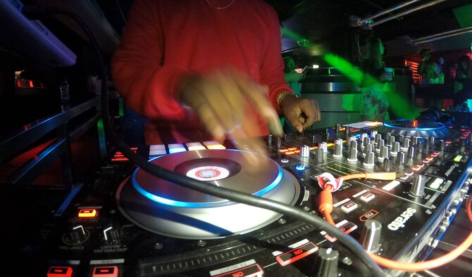 U.S. Air Force Staff Sgt. Elijah Rasheed, 100th Logistics Readiness Squadron aircraft parts store supervisor, also known as ‘DJ Messiah’, mixes music for his disc jockey set at a local club in Cambridge, England, Sept. 2, 2018. DJ Messiah is known as Staff Sgt. Rasheed to his troops and tries his best to relate to his troops both on a personal and professional level.  (U.S. Air Force photo by Airman 1st Class Alexandria Lee)