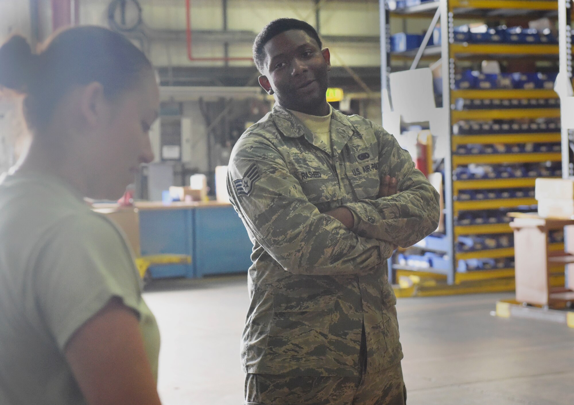 U.S. Air Force Airman 1st Class Daishanis Tran, 100th Logistics Readiness Squadron aircraft parts store journeyman, and Staff Sgt. Elijah Rasheed, 100th LRS APS supervisor, discusses Tran’s plans for scheduled leave at RAF Mildenhall, England, Sept. 4, 2018. Rasheed tries his best to relate to his troops both on a personal and professional level. (U.S. Air Force photo by Airman 1st Class Alexandria Lee)