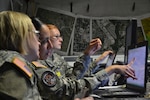 Capt. Jennifer Staton, a space operations officer, Sgt. Cassandra Quinones and Pfc. Miranda Yost, geospatial engineers, use mapping software during the multi-state large-scale, natural disaster emergency response exercise Vigilant Guard 2014, hosted by the Kansas National Guard in Salina, Kan., Aug. 4-7. The Soldiers are a part of Army Space Support Team 30, 117th Space Support Battalion with the Colorado National Guard. (Photo by Capt. Benjamin Gruver, 105th Mobile Public Affairs Detachment)