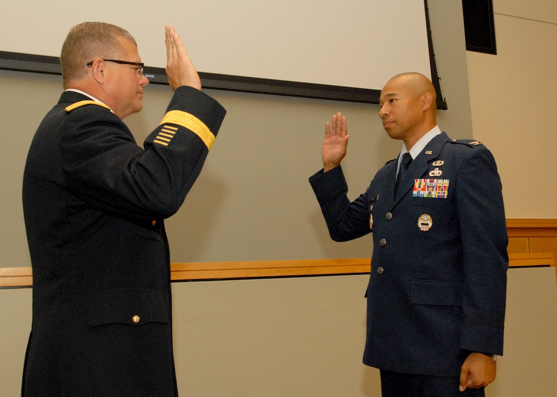 DLA Troop Support Commander Army Brig. Gen. Mark Simerly, left, officiates the promotion ceremony of new Clothing and Textiles Director Air Force Col. Melvin Maxwell August 30, 2018. Maxwell came on board in early August after serving at the Pentagon as chief of the enterprise strategy and analysis branch under the deputy chief of staff at Air Force Headquarters in Washington, D.C.