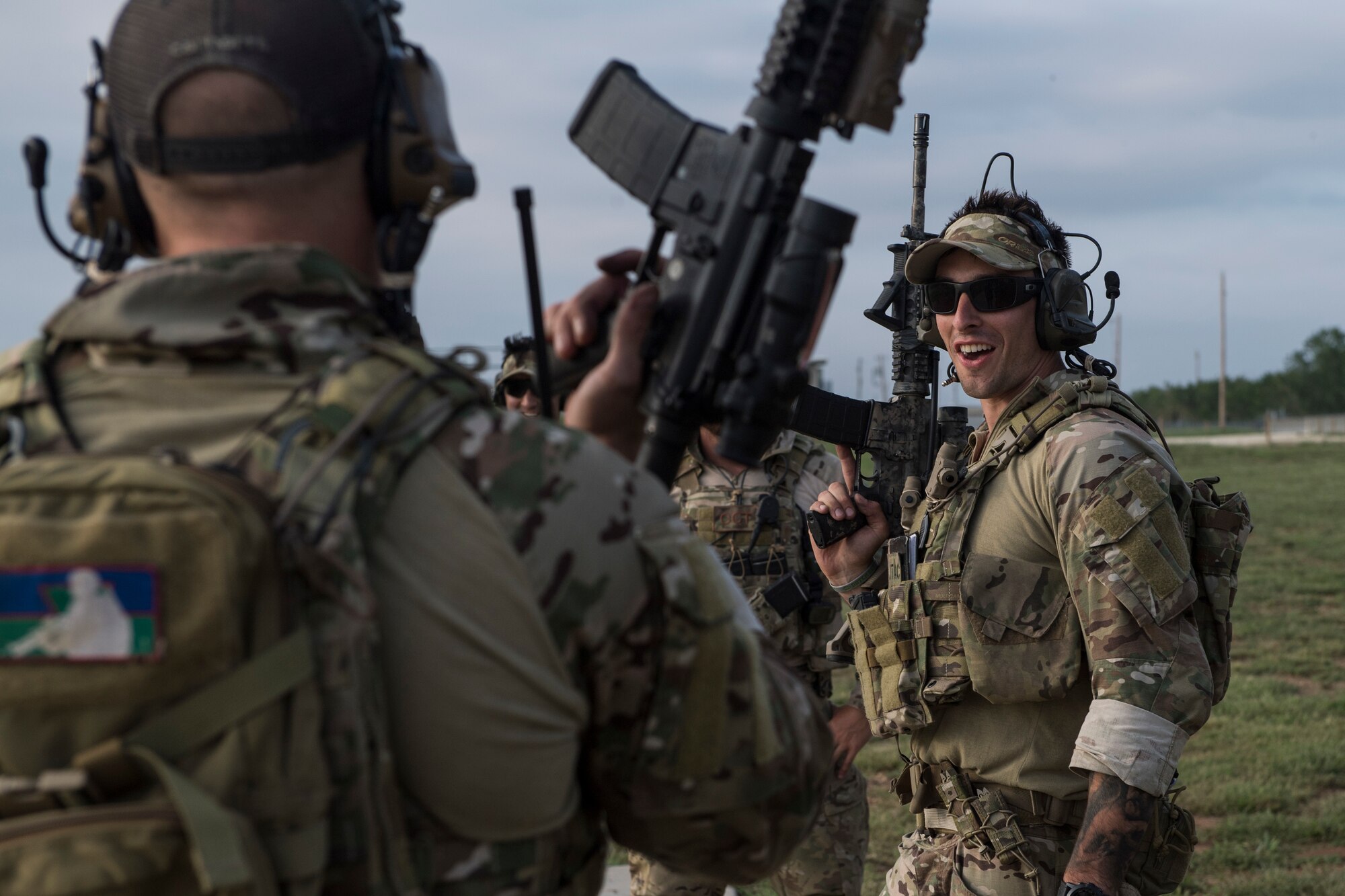 Students laugh during a full spectrum operator course, Aug. 28, 2018, at Smoky Hill Air National Guard Range, Kan. The course was held Aug. 26-31, and incorporated specific duties performed by tactical air control party members and security forces personnel to build on their gunfighting skills. (U.S. Air Force photo by Senior Airman Janiqua P. Robinson)