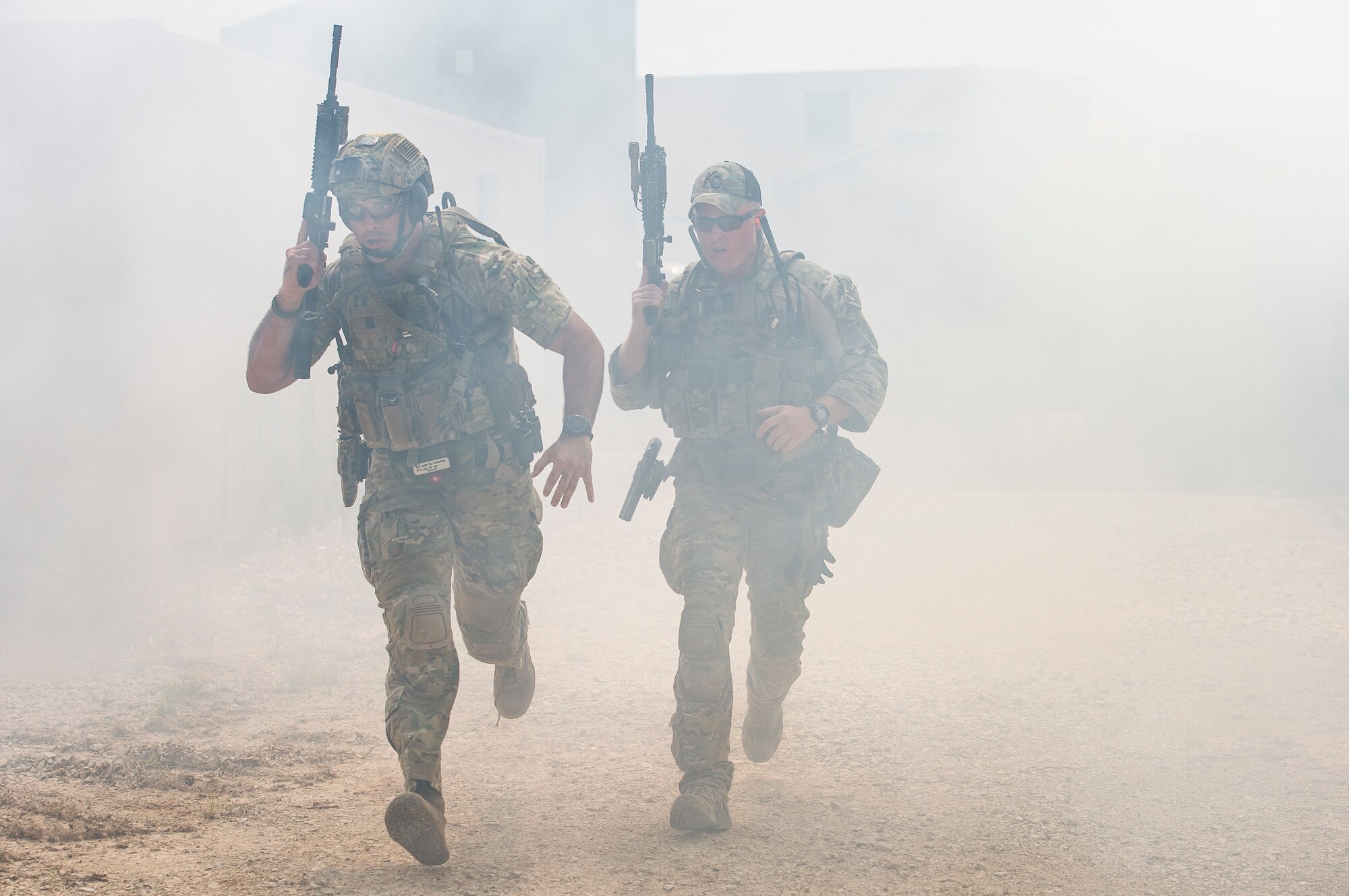 Students run for cover during a full spectrum operator course, Aug. 30, 2018, at Smoky Hill Air National Guard Range, Kan. The course was held Aug. 26-31, and incorporated specific duties performed by tactical air control party members and security forces personnel to build on their gunfighting skills. (U.S. Air Force photo by Senior Airman Janiqua P. Robinson)