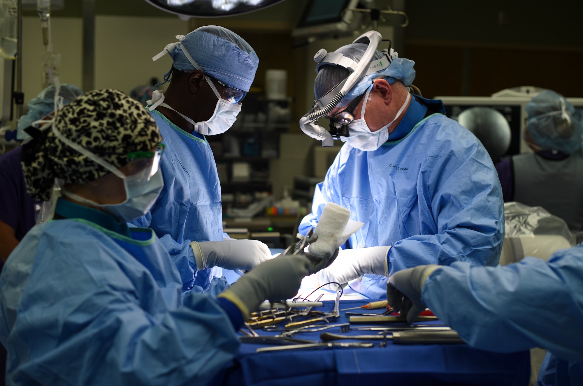Col. (Dr.) Edward Anderson, 99th Medical Group orthopedic spine surgeon, performs a lumbar microdiscectomy surgery at Nellis Air Force Base, Nevada, Aug. 27, 2018. A lumbar microdiscectomy surgery is performed to remove a portion of a herniated disc in the lower back. (U.S. Air Force photo by Airman 1st Class Andrew D. Sarver)