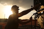 A U.S. Navy Equipment Operator drills during water well drilling exploration operations in Riohacha, Colombia.