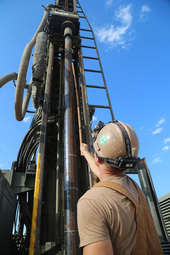 U.S. Navy Sailors drill during water well drilling exploration operations in Riohacha, Colombia.