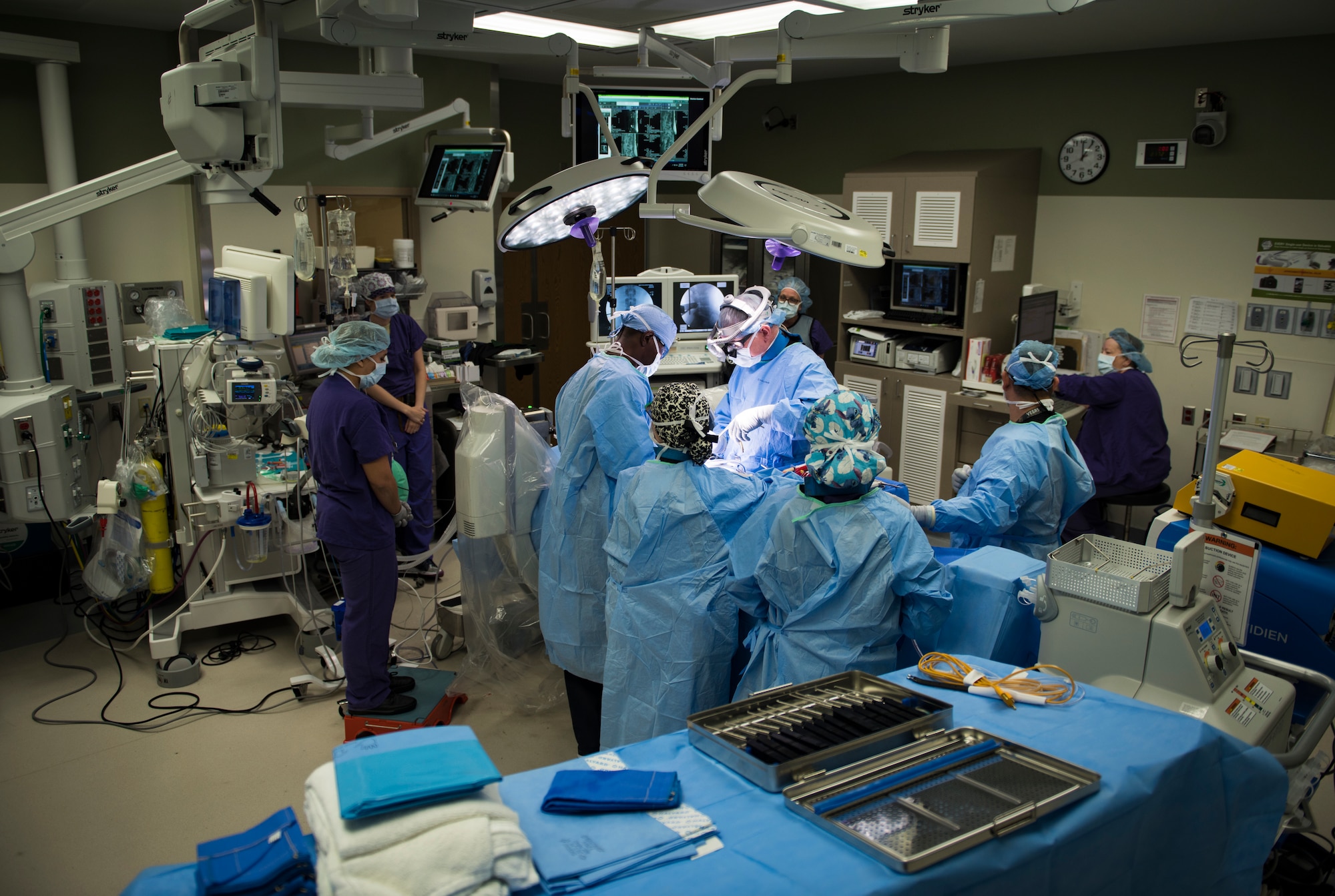 Airmen assigned to the 99th Medical Group perform in an orthopedic spine surgery at Nellis Air Force Base, Nevada, Aug. 27, 2018. Having in-house surgeons allows patients to bypass referrals downtown. (U.S. Air Force photo by Airman 1st Class Andrew D. Sarver)