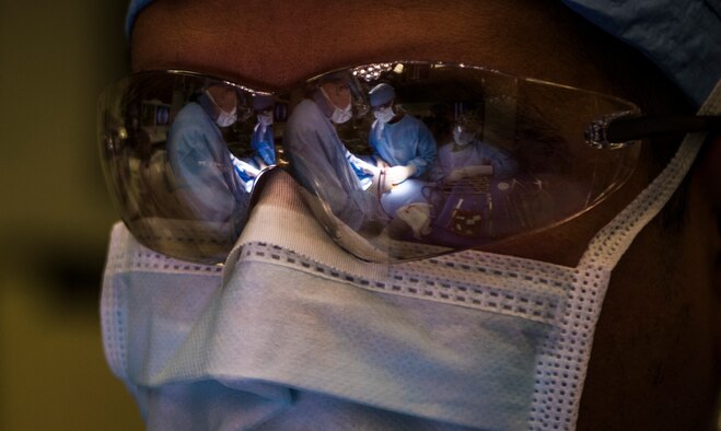 Luis Contreras, a contractor orthopedic technician with the U.S. Air Force 99th Medical Group, performs a lumbar microdiscectomy surgery at Nellis Air Force Base, Nevada, Aug. 27, 2018. A lumbar microdiscectomy surgery is performed to remove a portion of a herniated disc in the lower back. (U.S. Air Force photo by Airman 1st Class Andrew D. Sarver)