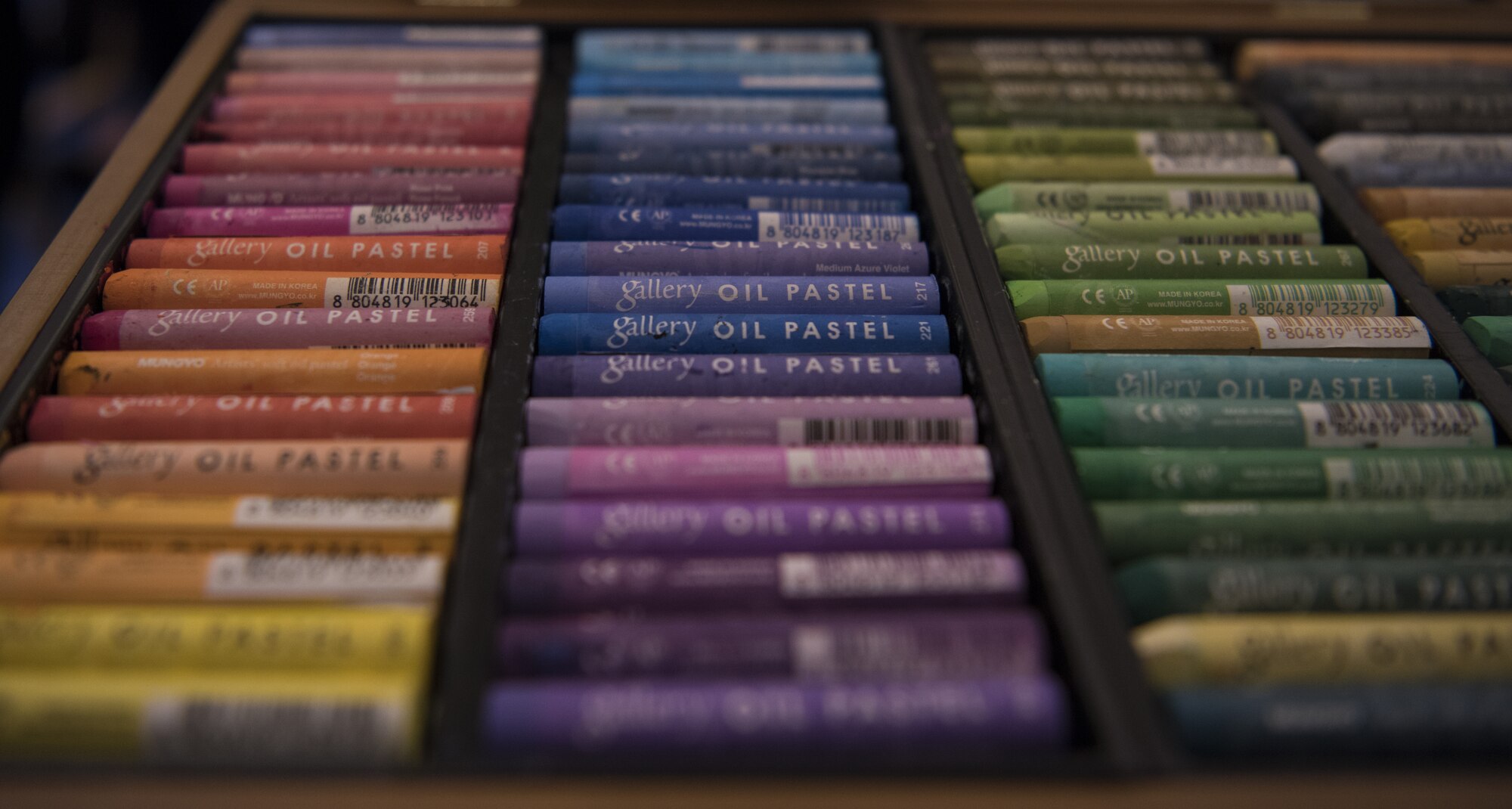 Oil pastels lay on a table during a sketch night at the Society of Illustrators Museum in New York, Aug. 30, 2018. Local Artist traveled from around New York to sketch military working dogs and their handlers while listening to them speak about the military. Artists used a variety of tools to sketch out their subjects such as pencils, paint brushes, crayons or oil pastels.