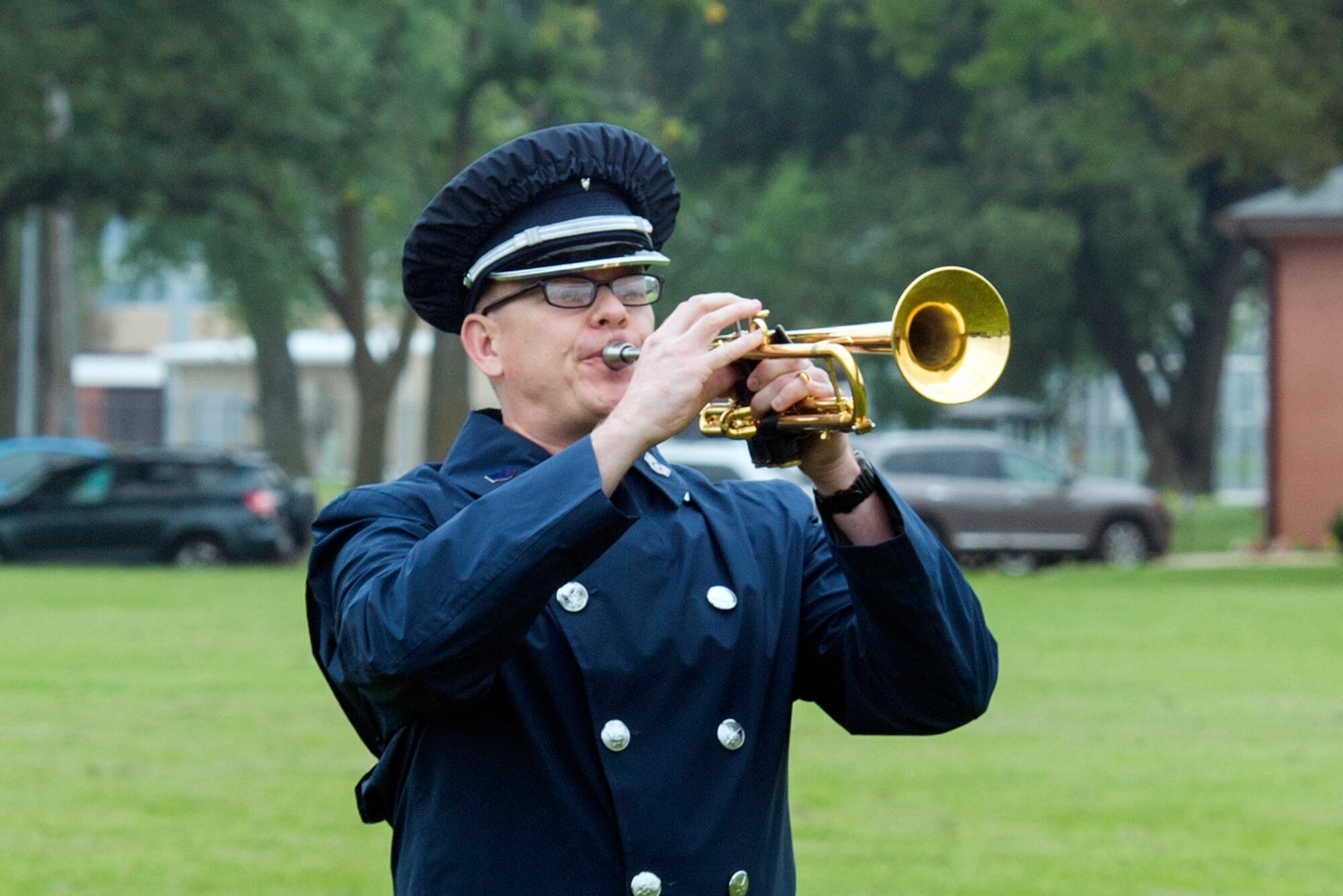 U.S. Air Force Staff Sgt. Daniel Thrower, Heartland of America Band hornist, plays “Taps,” during the 60528 Remembrance Ceremony Aug. 30, 2018, at Offutt Air Force Base, Nebraska. The ceremony was held to honor the 17 crewmembers who were lost during the Cold War when their C-130, which was modified to fly reconnaissance missions, was shot down. The aircraft’s tail number was 60528. (U.S. Air Force Photo by L. Cunningham)