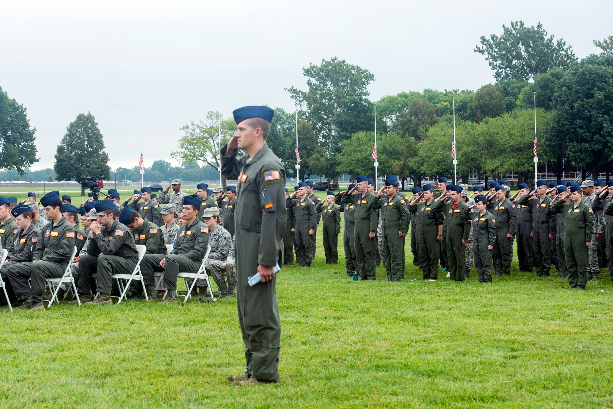U.S. Air Force Master Sgt. Ken, 97th Intelligence Squadron superintendent of operations support, stands and salutes along with a formation of 97th IS Airman as “Taps,” plays during the 60528 Remembrance Ceremony Aug. 30, 2018, at Offutt Air Force Base, Nebraska. The ceremony was held in remembrance of 17 crewmembers who lost their lives when 60528, a C-130 modified to fly reconnaissance missions, was shot down during the Cold War.  (U.S. Air Force photo by L. Cunningham)