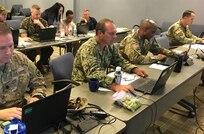 Members from Joint Task Force Civil Support become students as they learn a program for online collaboration with a goal to enhance the organization's unity of effort Sept. 5 at Mullan Hall. A top priority of JTF-CS' commanding general, U.S. Army Maj. Gen. Bill Hall, such unity allows responders to communicate effectively during Defense Support of Civil Authority and helps reduce the fog and friction that occurs when responding to complex catastrophic events. (DoD photo by Lt. Col. Karen Roganov)