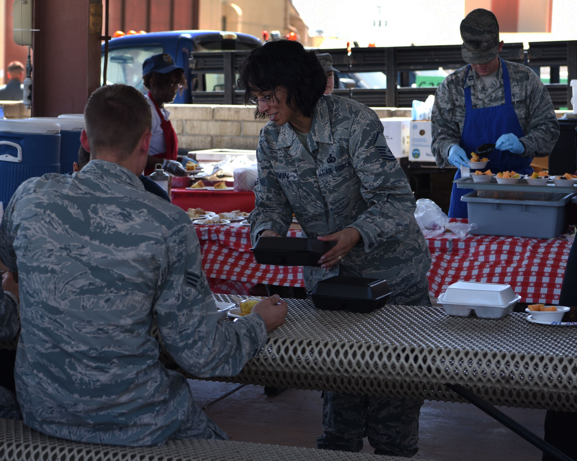 Master Sgt. Melissa Gavin, 56th Fighter Wing Chaplain office superintendent of religious affairs, prepares to-go meals for Airmen during the Flightline Feast Sept. 6, 2018, at Luke Air Force Base, Ariz.