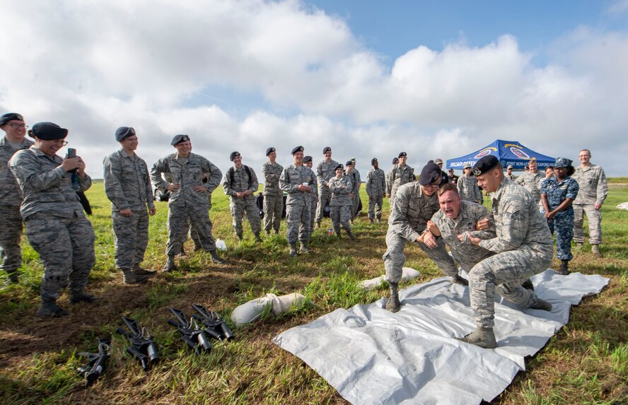 Staff Sgt. Brandon Orr, 375th Logistics Readiness Squadron vehicle operator, is tasered during the Non-Lethal Weapons Familiarization event Aug. 30, 2018, at the Illinois National Guard Training Area in Sparta, Illinois.